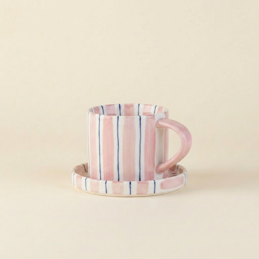 Pink striped ceramic cup and saucer