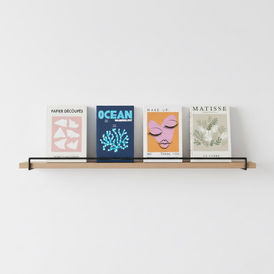 Artsy edition faux book boxes on a picture ledge