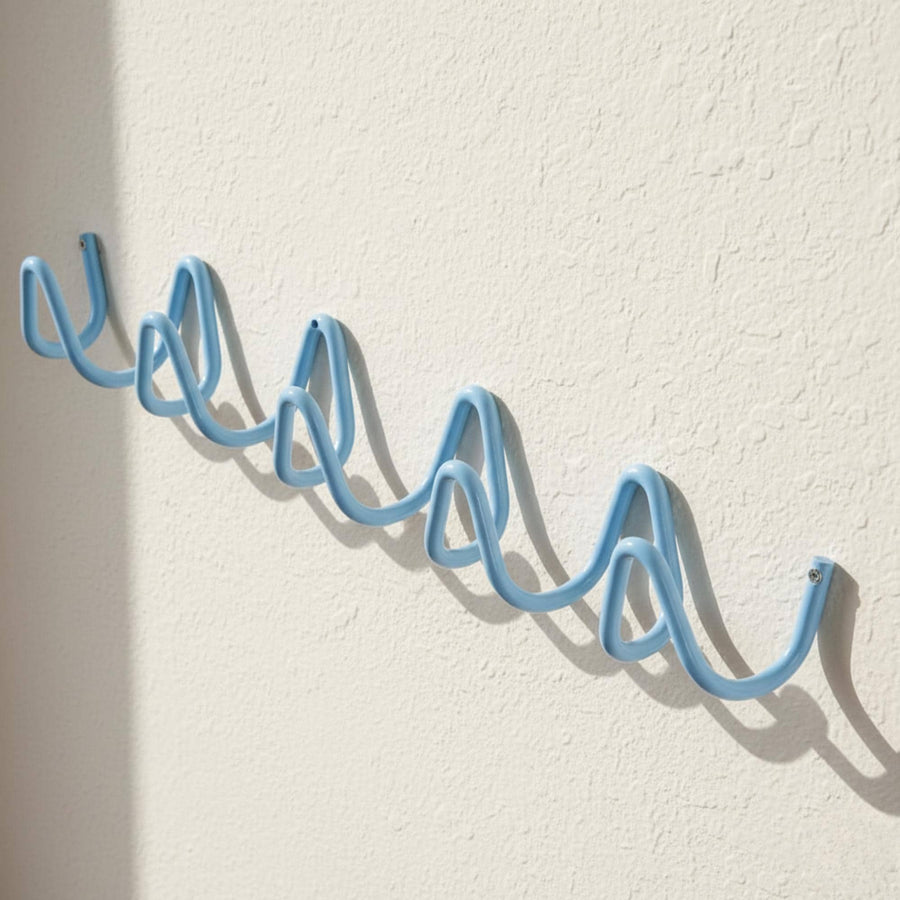 Wave Hook Rail — styled in a minimal hallway with a coat and tote bag