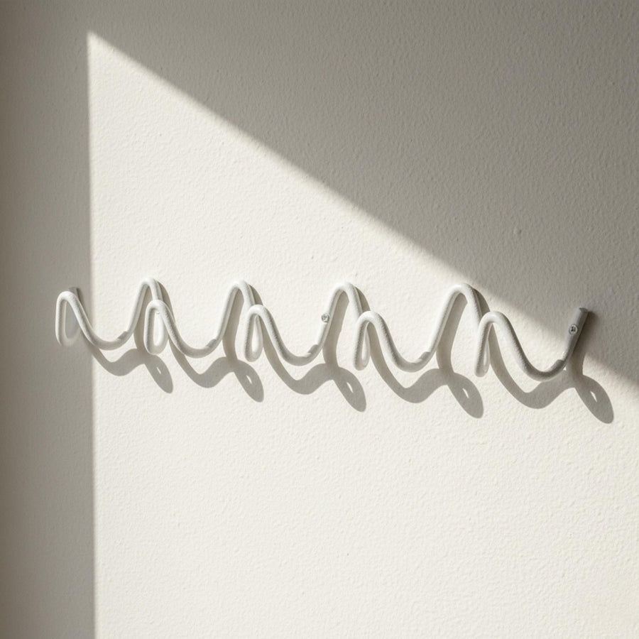 Wave Hook Rail — detail of hook curvature, clean bauhaus wave shape