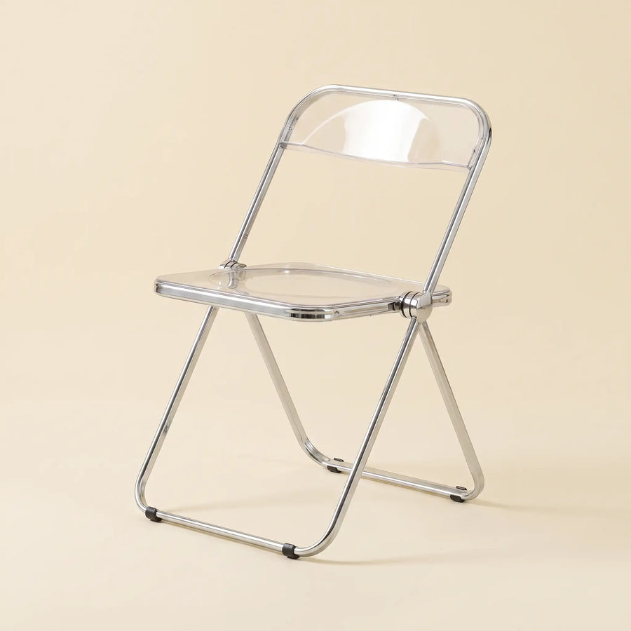 Lucent Folding Chair in Clear — translucent acrylic seat, chrome folding frame