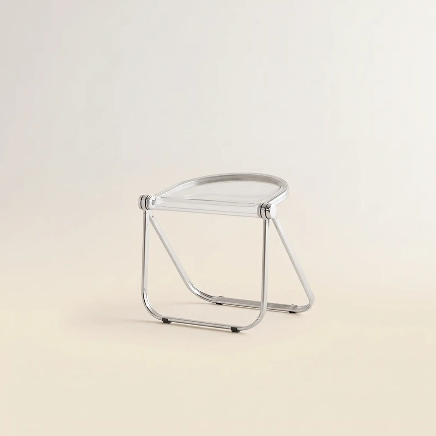 Lucent Folding Stool in Clear — translucent acrylic seat, chrome folding frame