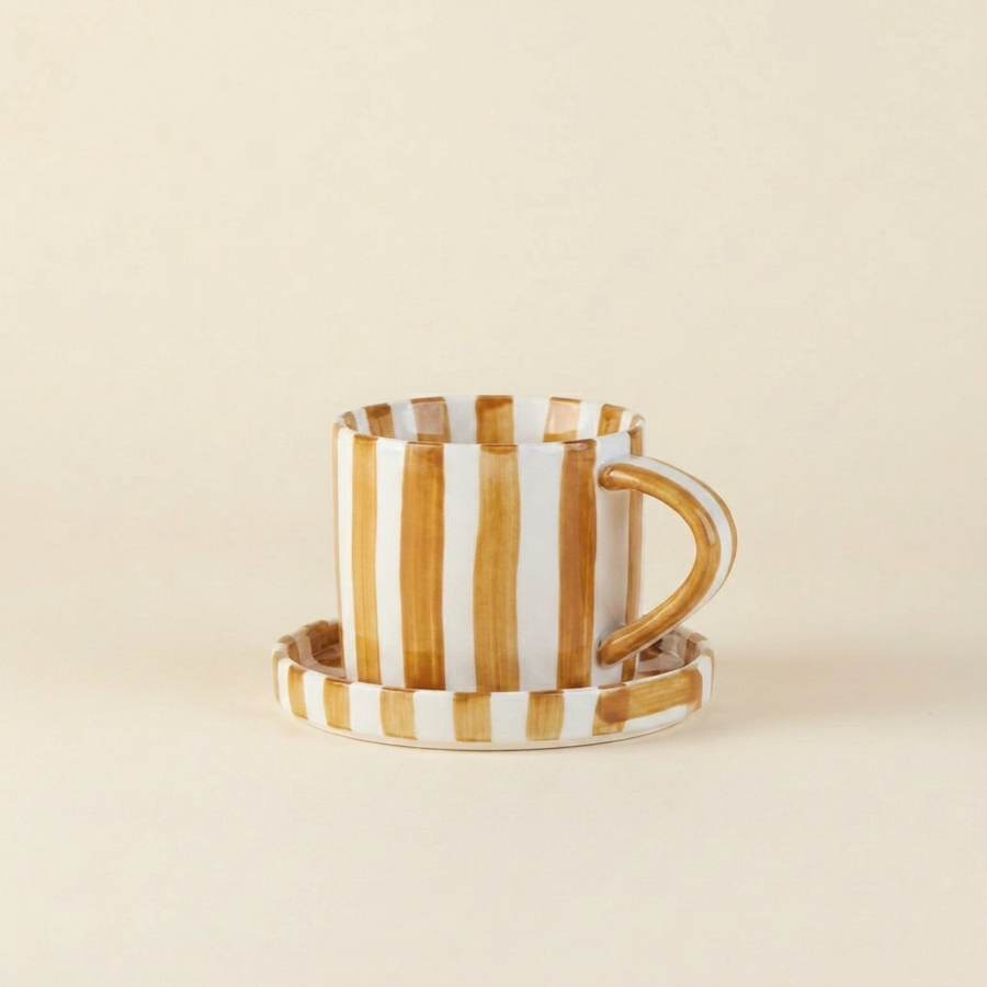 Brown striped ceramic cup and saucer