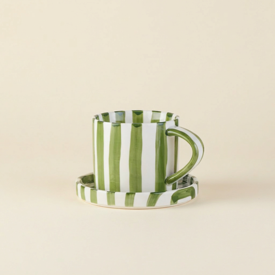 Green striped ceramic cup and saucer