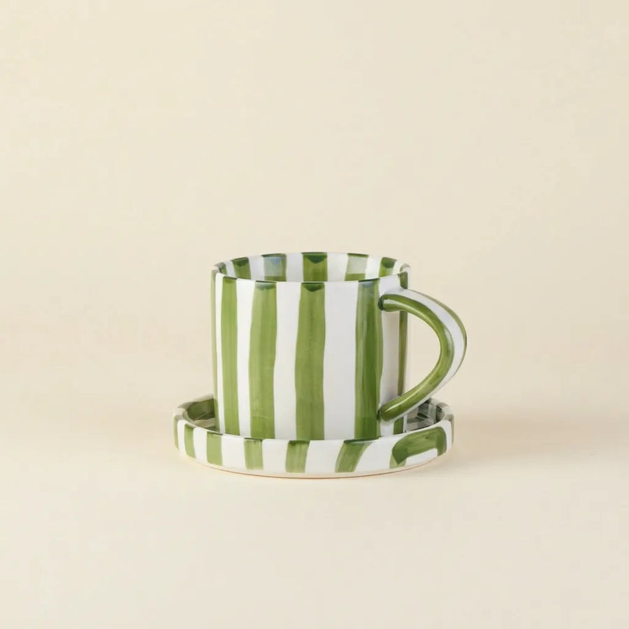 Green striped ceramic cup and saucer