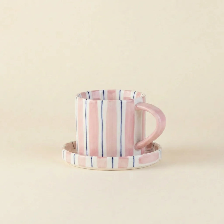 Pink striped ceramic cup and saucer