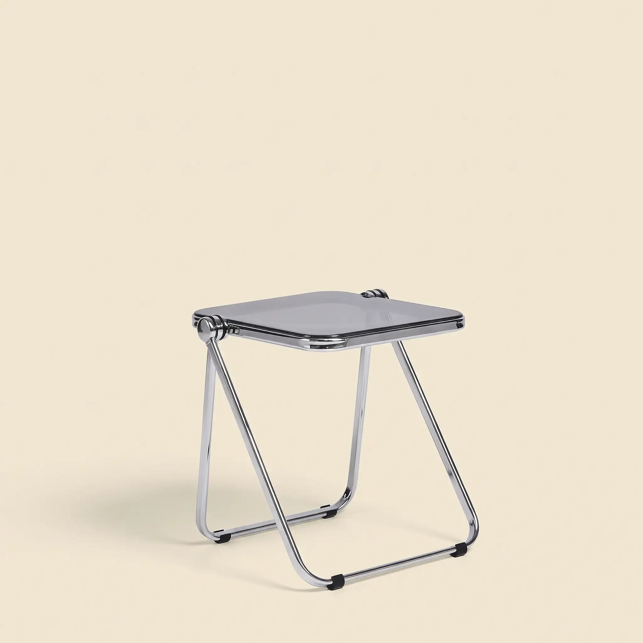 Lucent Tray Table in Grey — smoky translucent grey acrylic top, chrome A-frame folding base