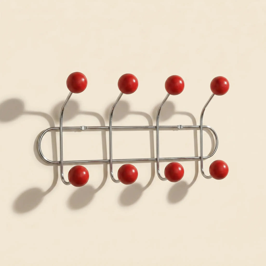Wall Mounted Orbit Hook Rail in chrome and wood, styled in an entryway