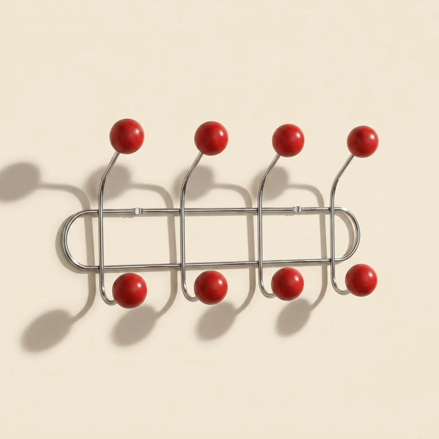 Wall Mounted Orbit Hook Rail in chrome and wood, styled in an entryway
