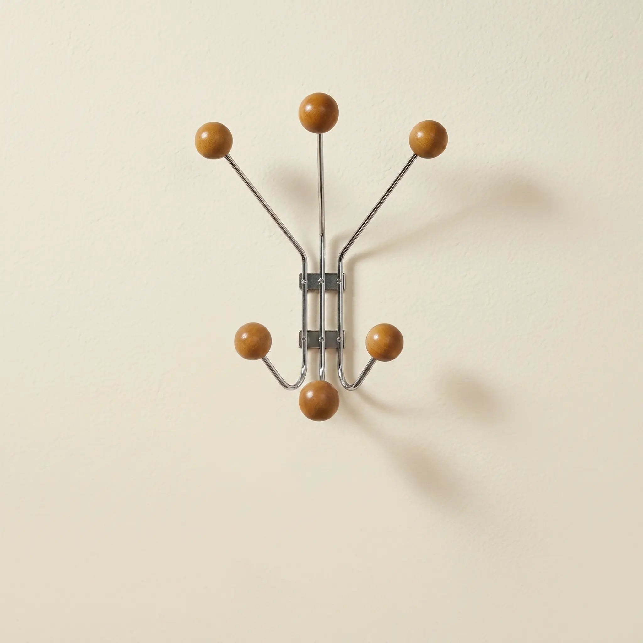 Wall Mounted Stellar Coat Rack in chrome and wood, six-hook starburst design