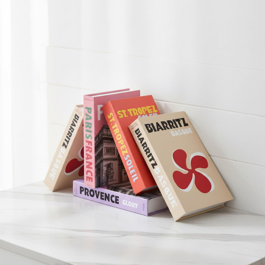 France edition faux book boxes stacked on a table