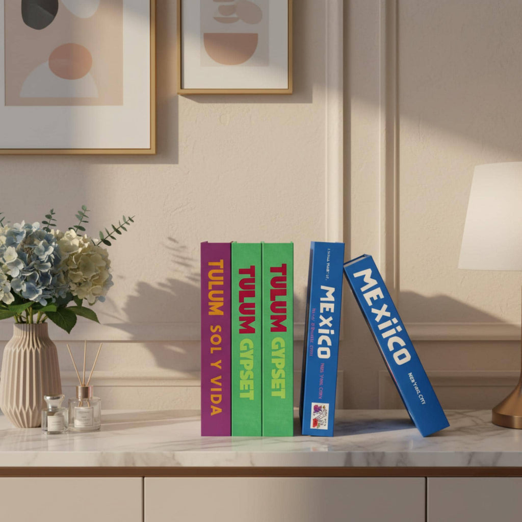 Mexico edition faux book boxes on a console table