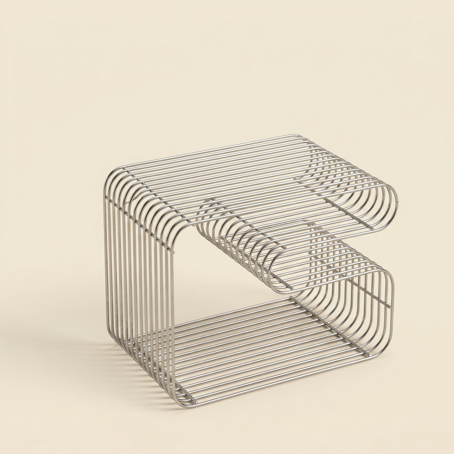 Linea Side Table in stainless steel wire styled in a living room corner