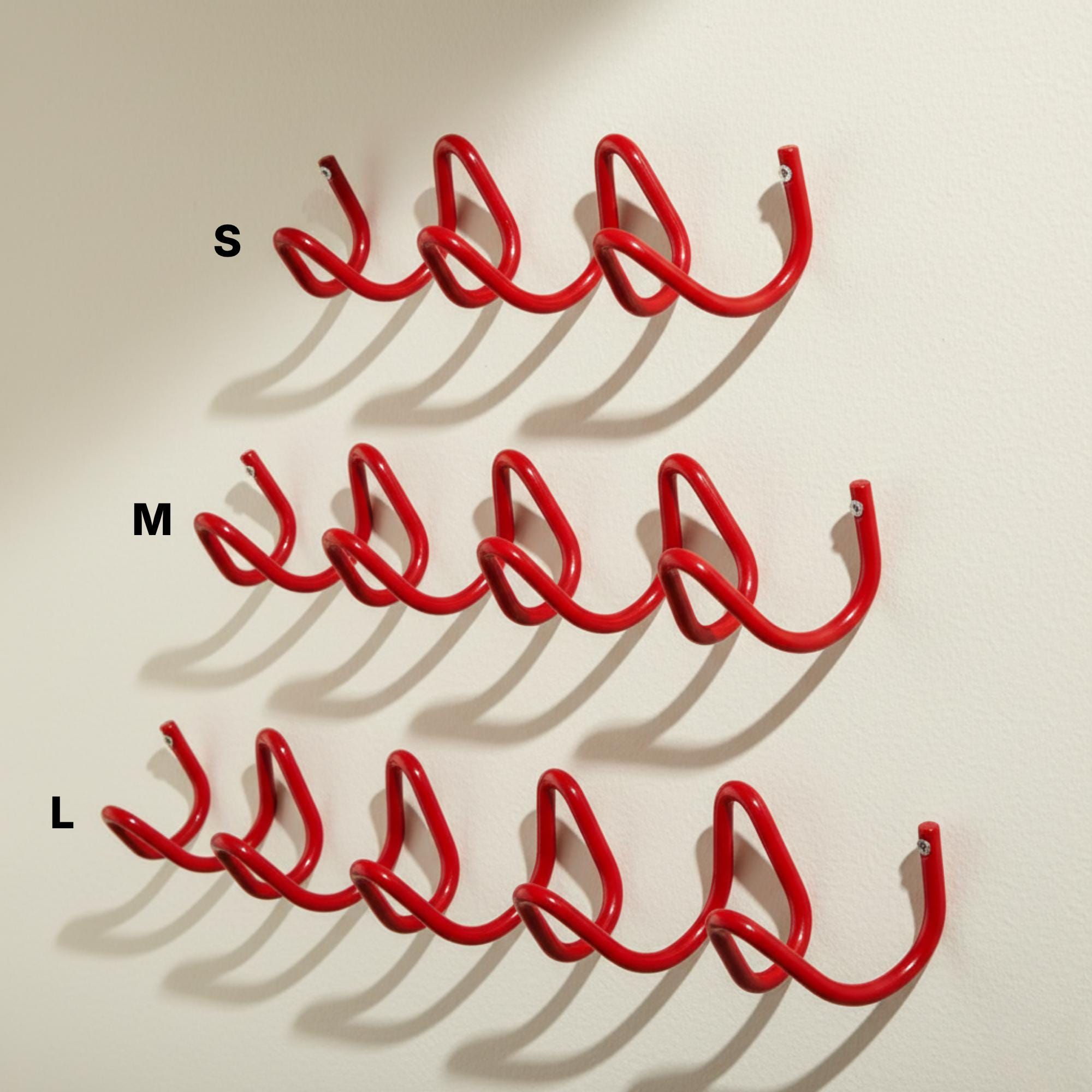 Wave Hook Rail in use — coats and bags hanging in an entryway