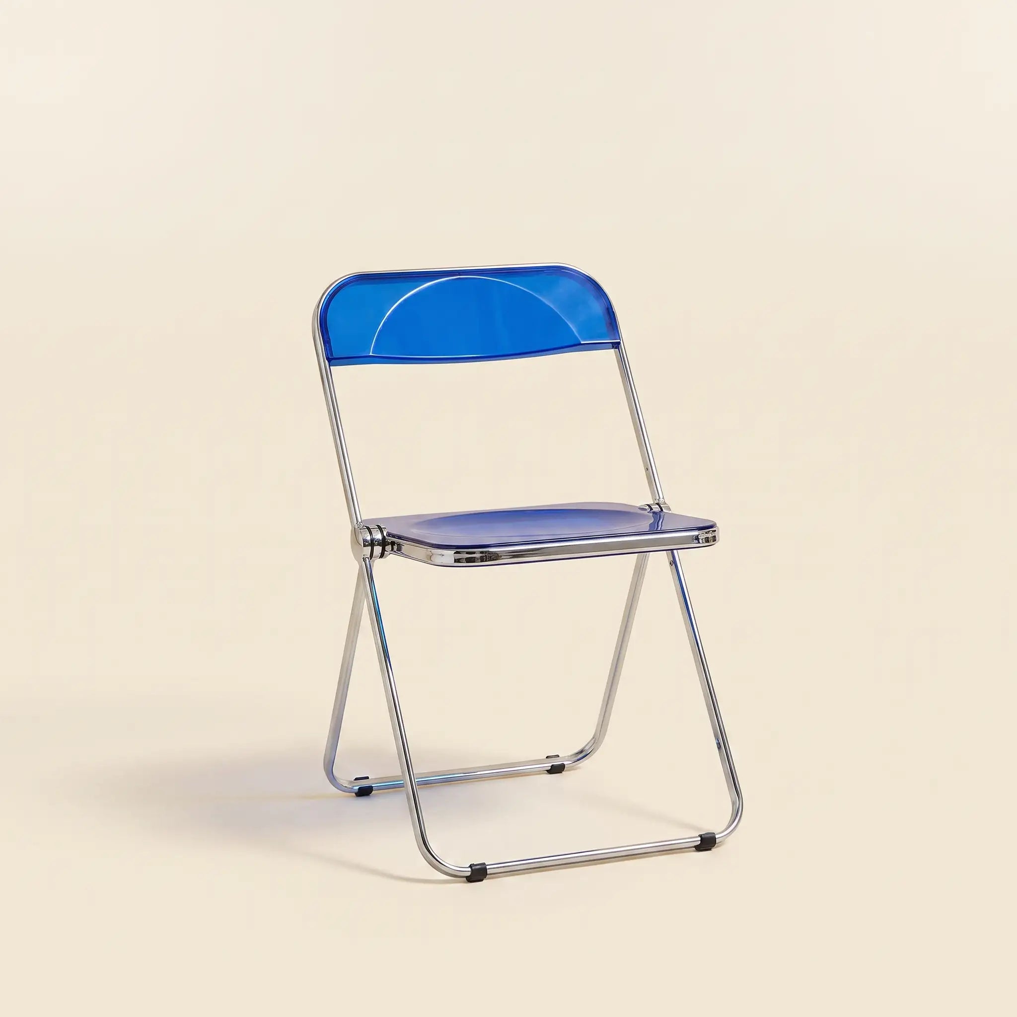 Lucent Folding Chair in Blue — translucent acrylic seat, chrome folding frame