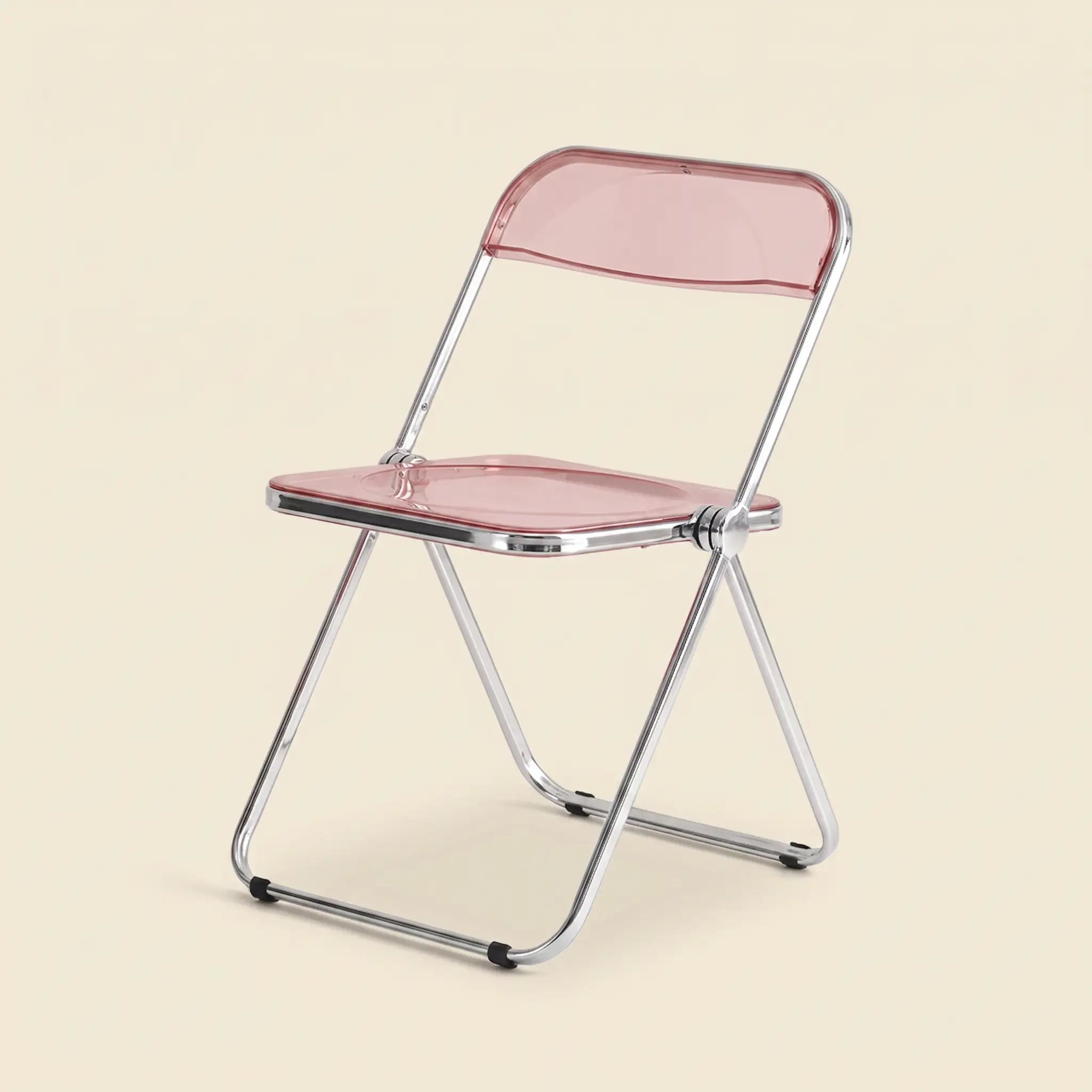 Lucent Folding Chair in Pink — translucent acrylic seat, chrome folding frame