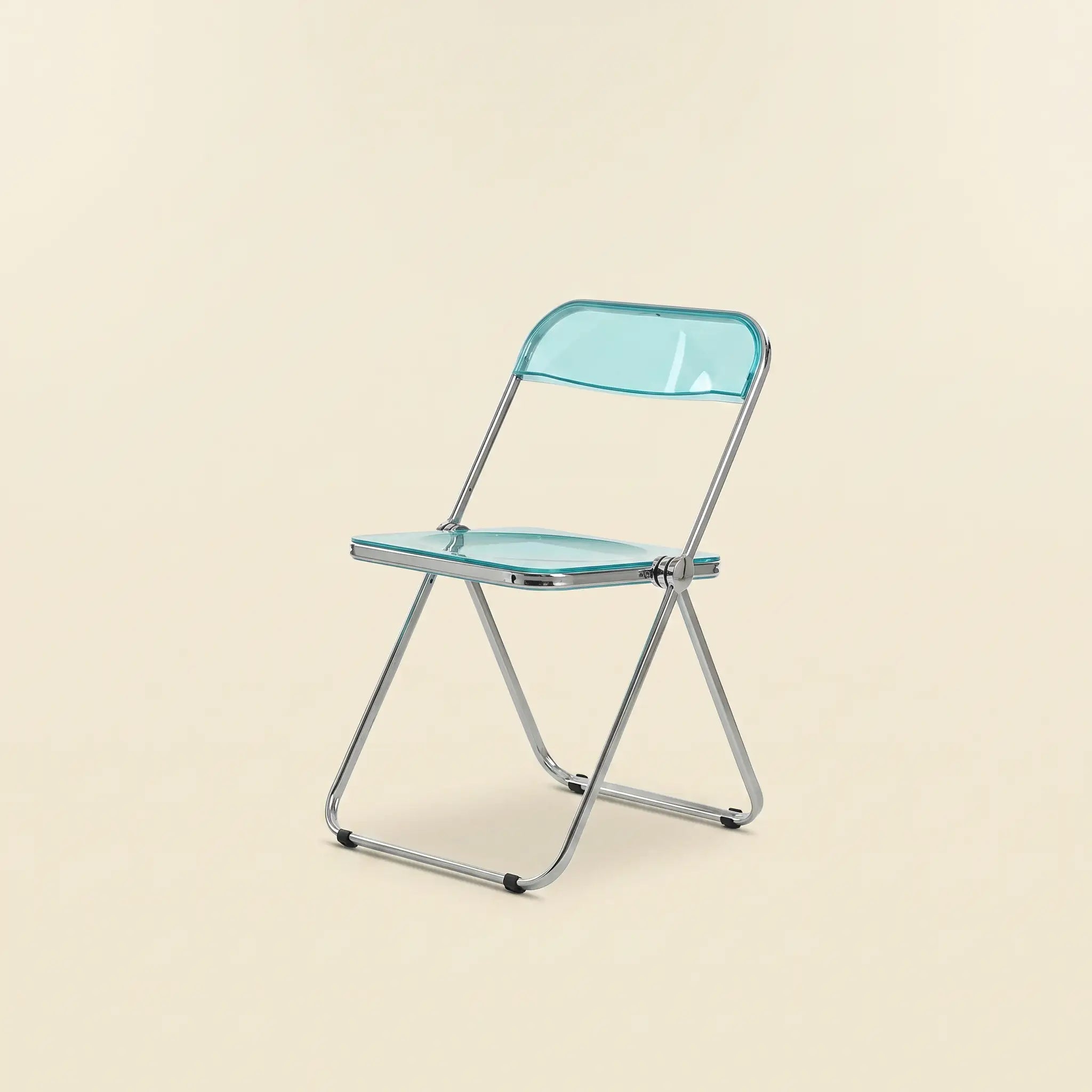Lucent Folding Chair in Turquoise — translucent acrylic seat, chrome folding frame