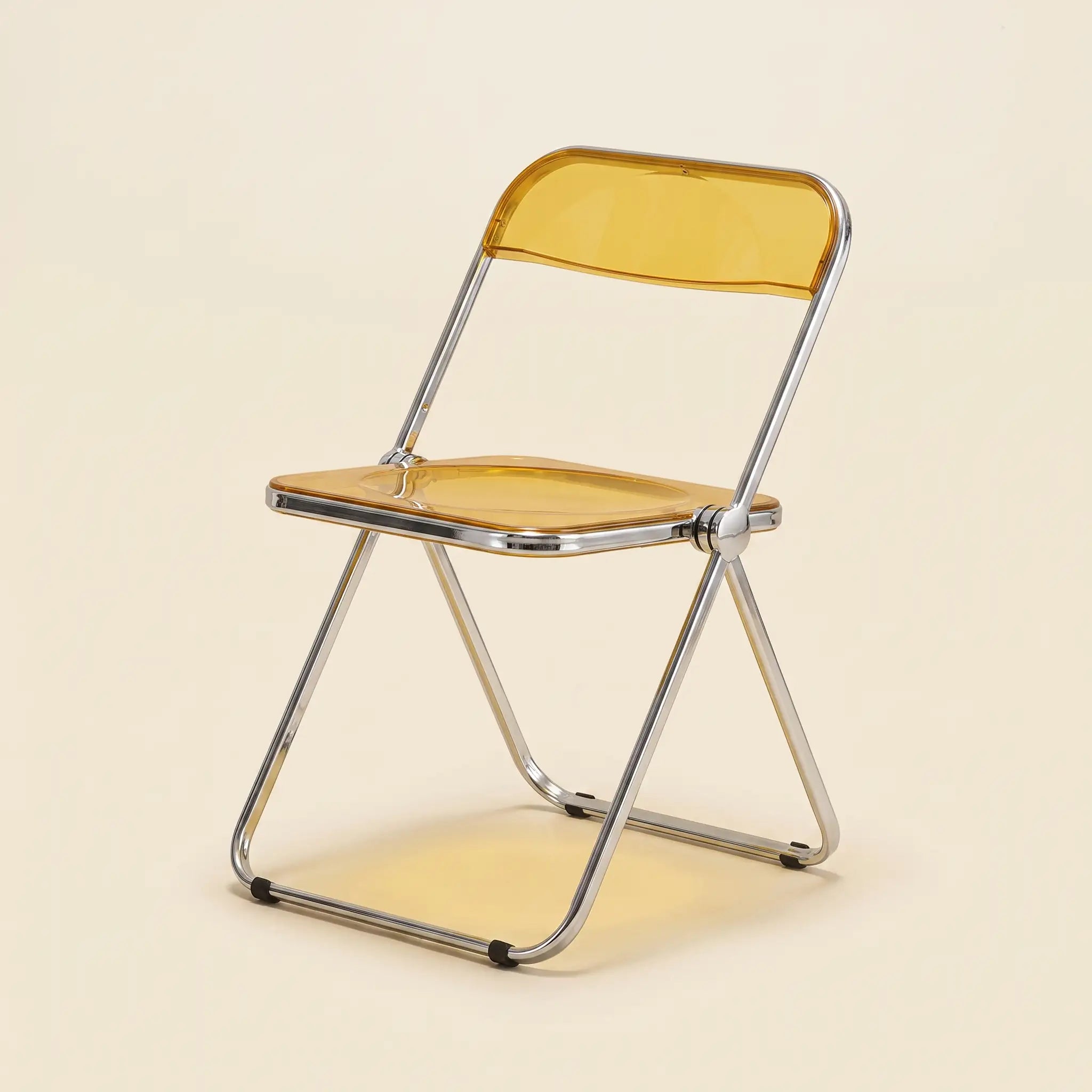 Lucent Folding Chair in Yellow — translucent acrylic seat, chrome folding frame