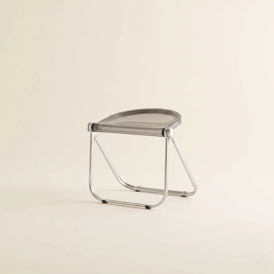 Lucent Folding Stool in Grey — translucent acrylic seat, chrome folding frame