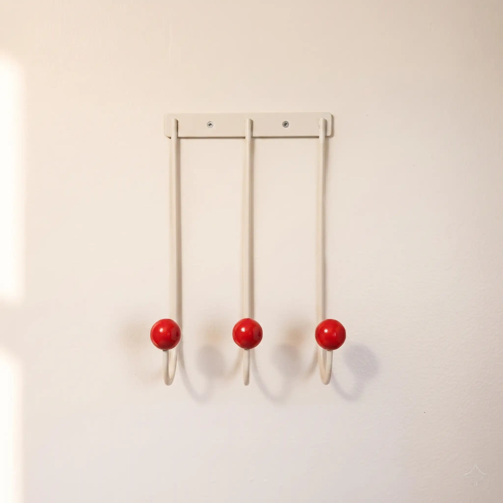 Sphere Hook Trio in White — cream 3-hook wall rack with red wood ball tips
