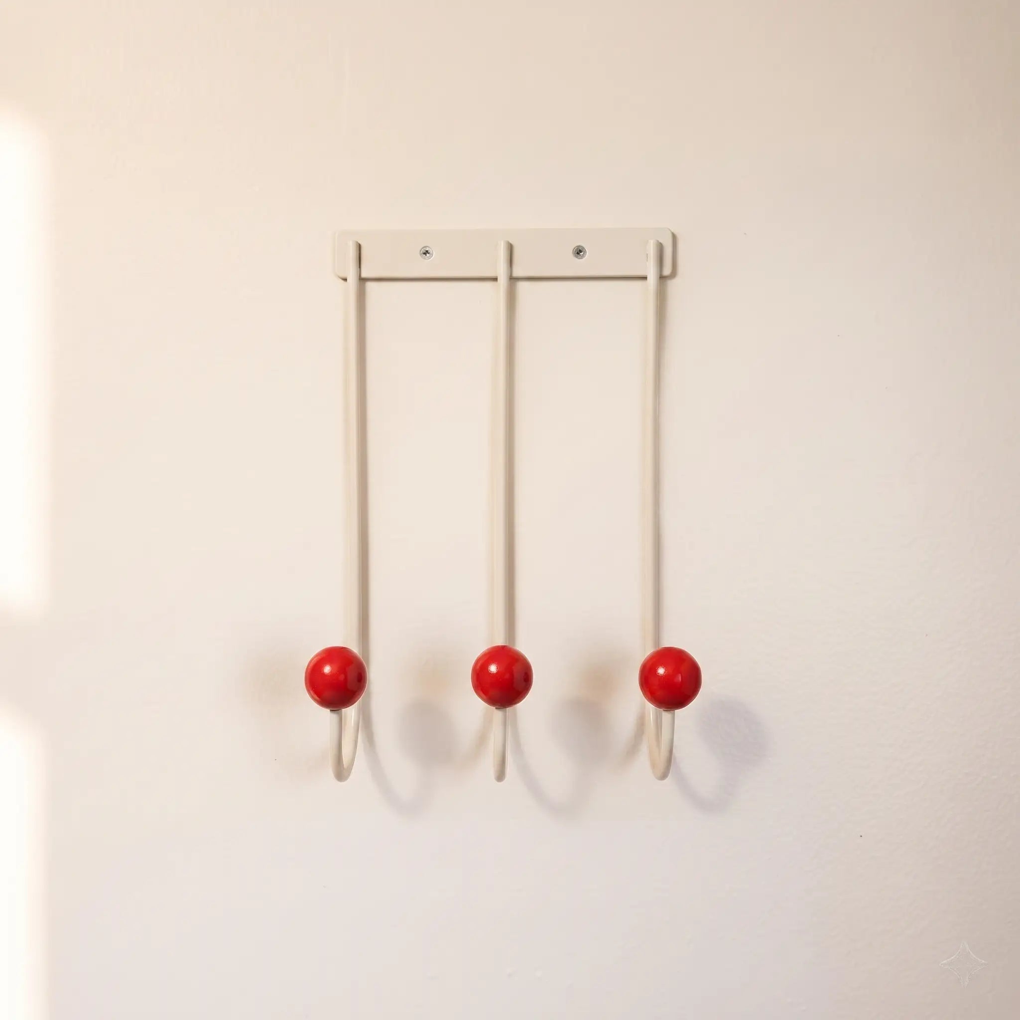 Sphere Hook Trio in White — cream 3-hook wall rack with red wood ball tips