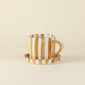 Brown striped ceramic cup and saucer
