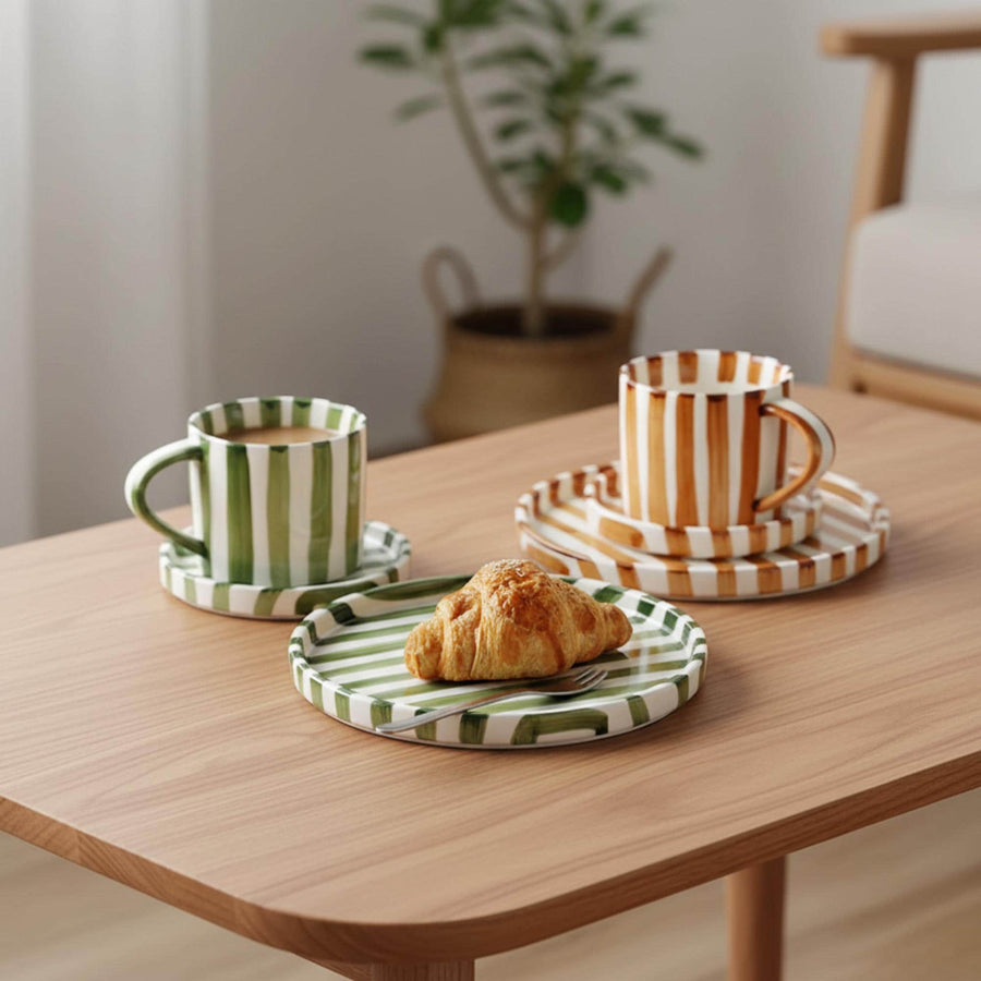 Striped ceramic cup and saucer on a table