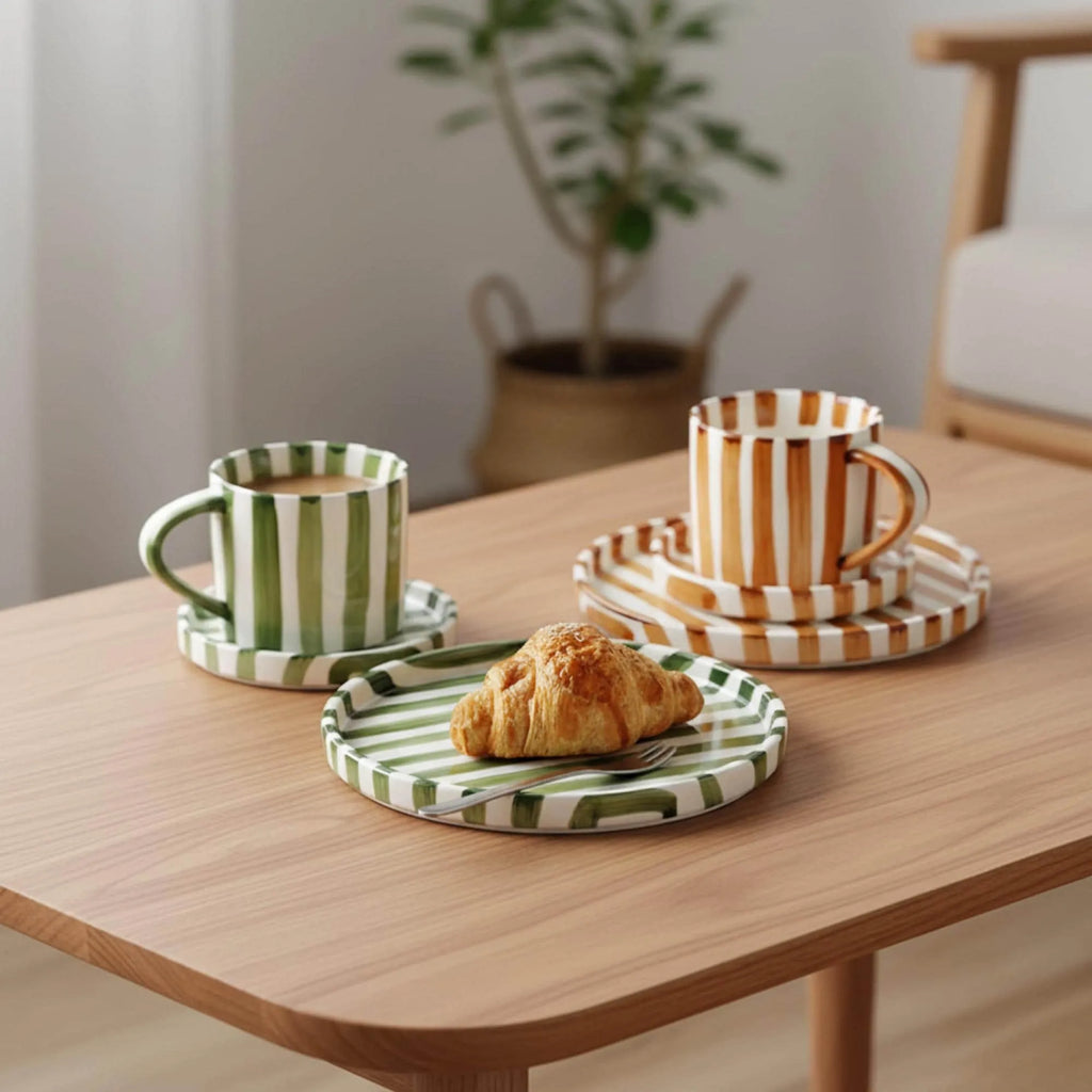 Striped ceramic cup and saucer on a table