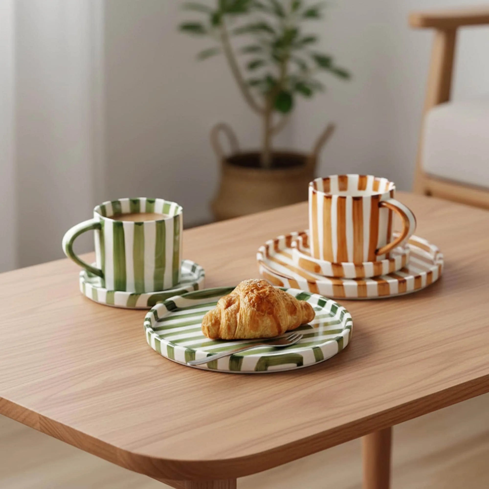 Striped ceramic cup and saucer on a table