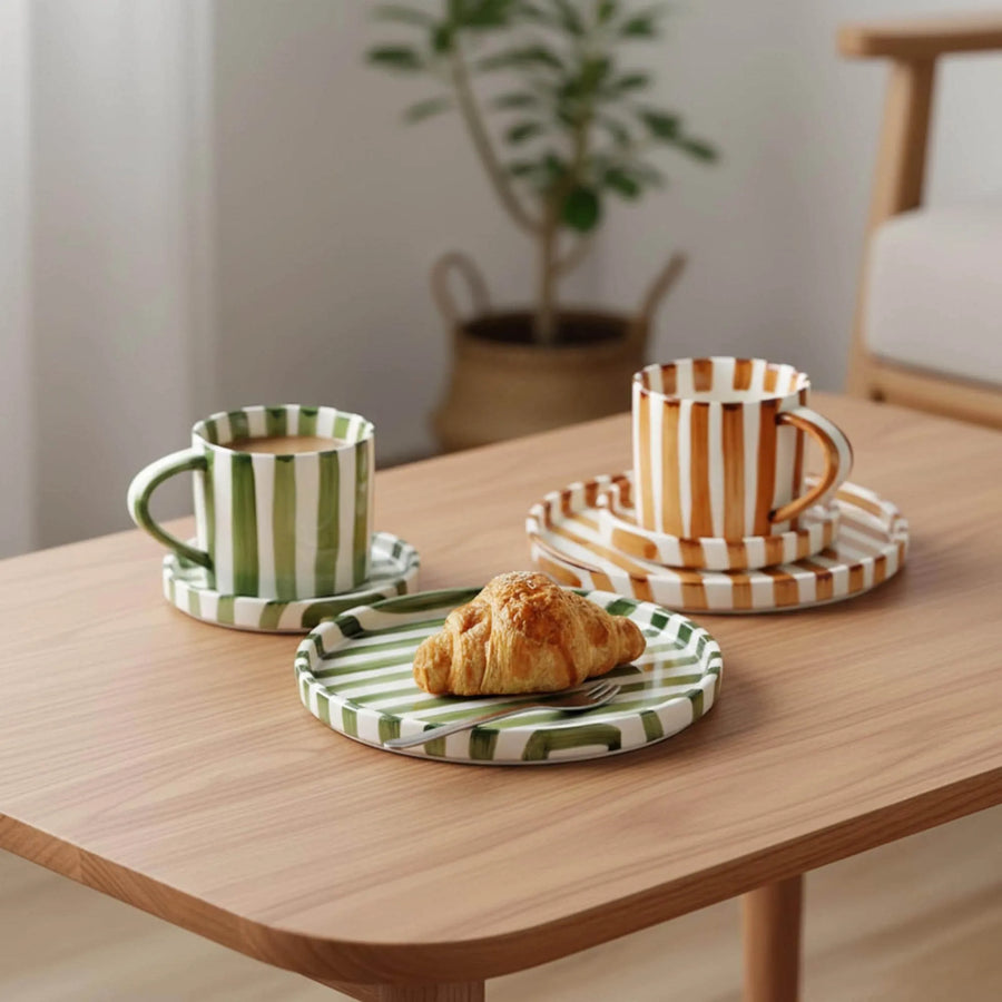 Striped ceramic cup and saucer on a table